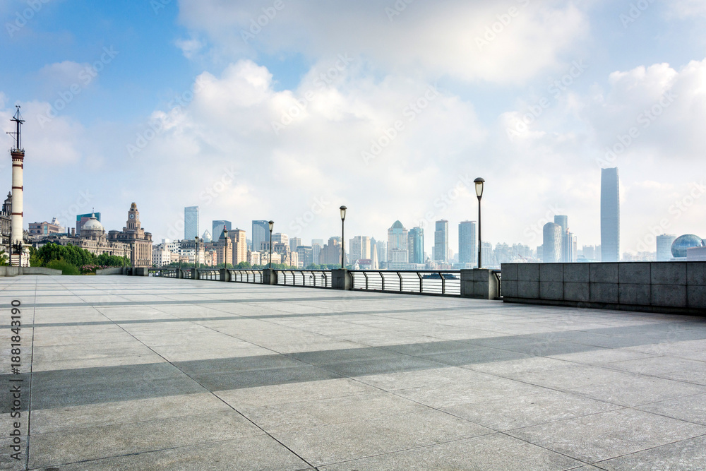 Obraz premium Modern Urban Skyline with Empty Plaza and Street Lamps