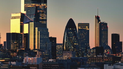 Aerial panorama of London skyscrapers buildings, blending historical and contemporary architecture. Modern business center, cityscape skyline night background. Travel destination. Drone flight