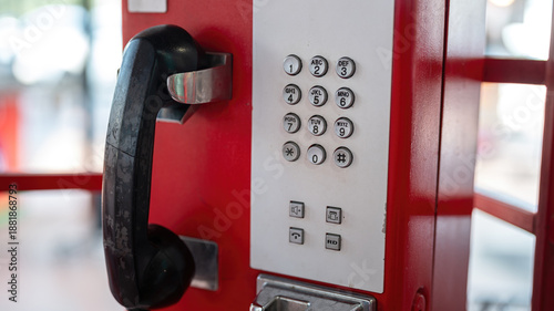 Tableau sur toile Classic style telephone booth or payphone in red color, the iconic of telecommunication system