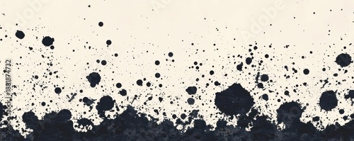 Abstract black and white artwork featuring splattered paint, creating a dynamic visual effect with a textured appearance.