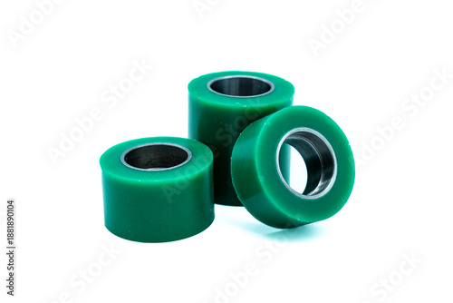 Fotografie Three Vibrant Green Rubber Bushings with Steel Cores