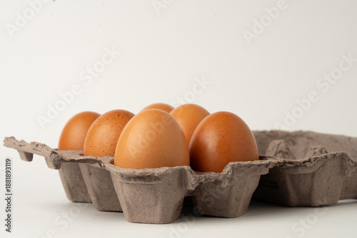 Pack of six eggs in a cardboard carton