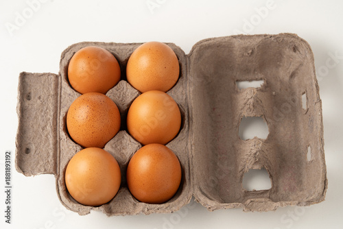 Six eggs packaged in a cardboard carton