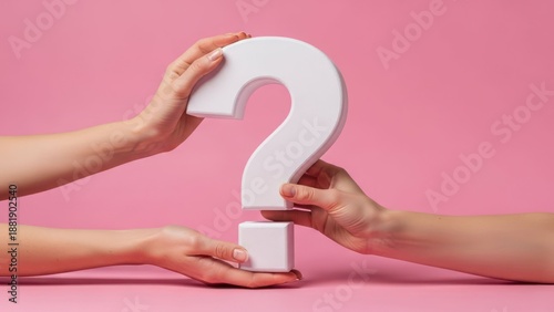 Two hands hold a white, 3D question mark against a pink background