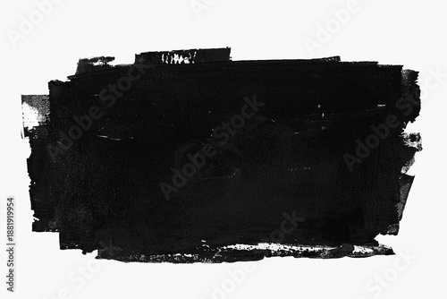 Abstract black paint brushstroke smudge with rough texture, isolated on a white background with copy space.
