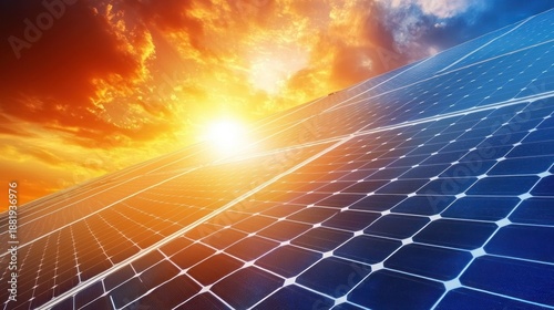 A solar panel array with a vibrant sunset in the background.
