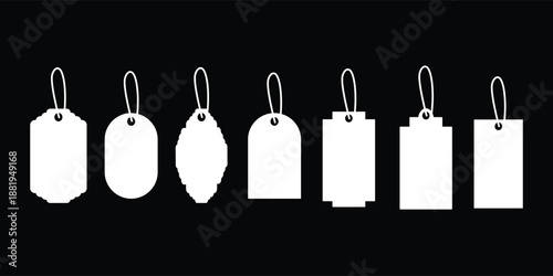 White hanging price tag label set on black background. Collection of blank retail tags in multiple shapes with strings. Minimal product labeling design for sales and branding use. 