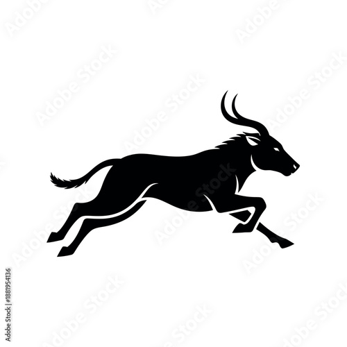 Silhouette of a running wildebeest.