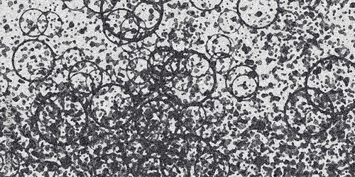 Abstract monochrome background with overlapping circular shapes and granular texture, suggesting a microscopic view or artistic representation of bubbles and particles
