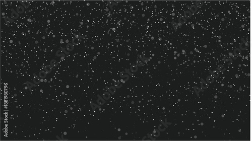 Scattered white particles on black background