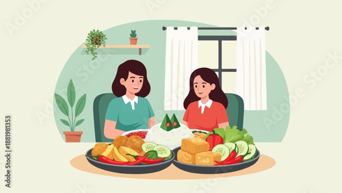 Two women enjoy a meal together with rice, fried food, and fresh vegetables