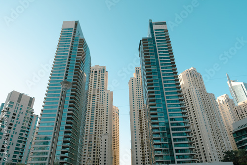 skyscrapers in Dubai Marina against blue sky with copy space, low angle view