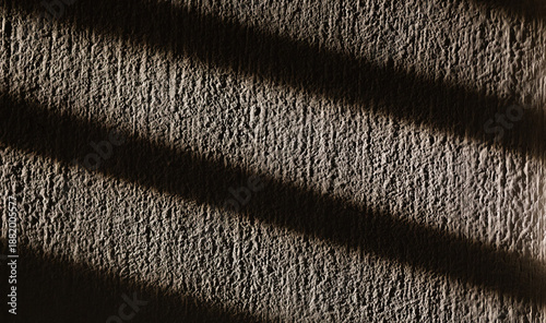 Bild auf Leinwand ombre scure proiettate in diagonale sulla superficie di una parete di cemento gr