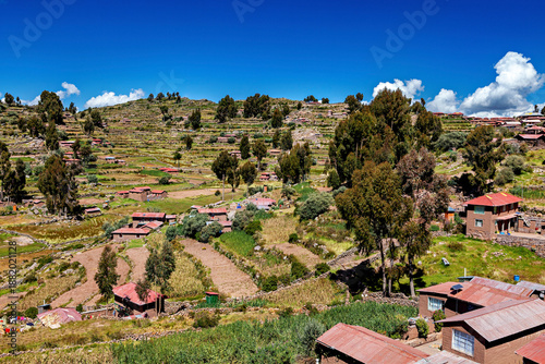 Bild auf Leinwand The landscape and farmhouses on Taquile Island in Lake Titicaca, Peru