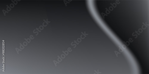 Sandblasted or brushed titanium or steel metal surface, the light reflection of the curved lines creates a smooth gradation on the dark black metallic background