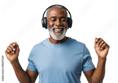 ecstatic senior african american man (65-75) in a blue t-shirt and wireless headphones, subtly dancing on a white studio background with copy space. concept of active lifestyle and audio enjoyment