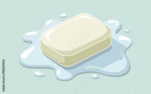 A bar of soap resting on a puddle of water, viewed from above on a light blue background