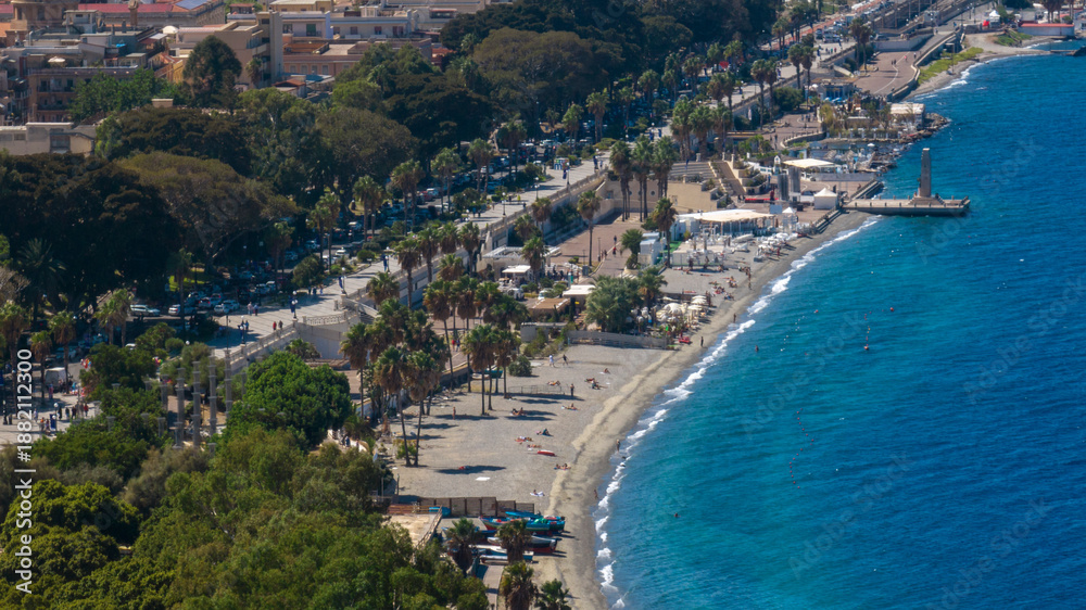 Fototapeta premium Aerial view of the waterfront of Reggio Calabria, southern Italy. The Falcomatà seafront overlooks the Mediterranean Sea and is known as the most beautiful kilometer in Italy. There is a urban beach.