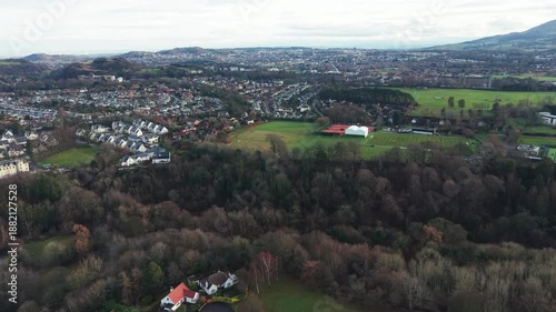 Aerial view of Edinburgh cityscape with the iconic Arthur's Seat mountain in the distance, Scotland