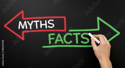Hand facts and myths arrows on blackboard with chalk