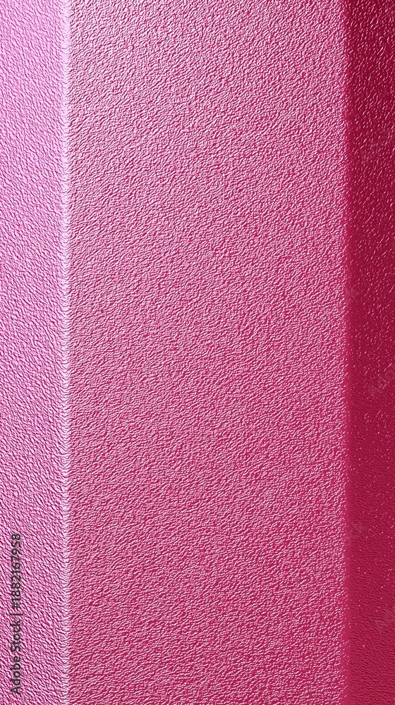 Fototapeta premium Pink textured surface with subtle lighting and shadows