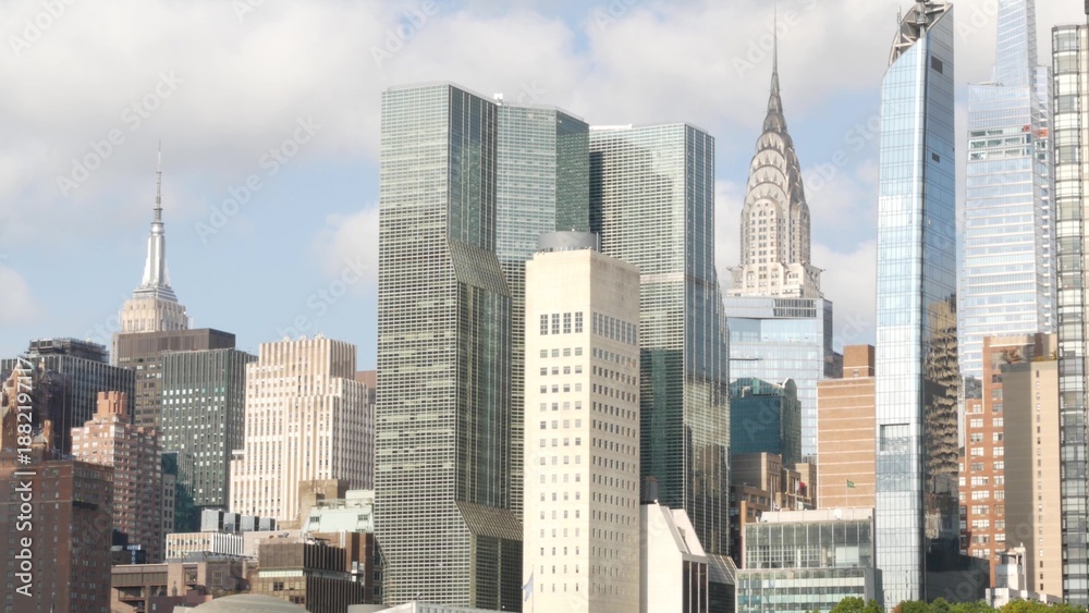 Naklejka premium New York City Manhattan Midtown skyline from Roosevelt Island, United States. Skyscraper building architecture, riverside cityscape, East River. Turtle Bay district high-rise towers, business center.