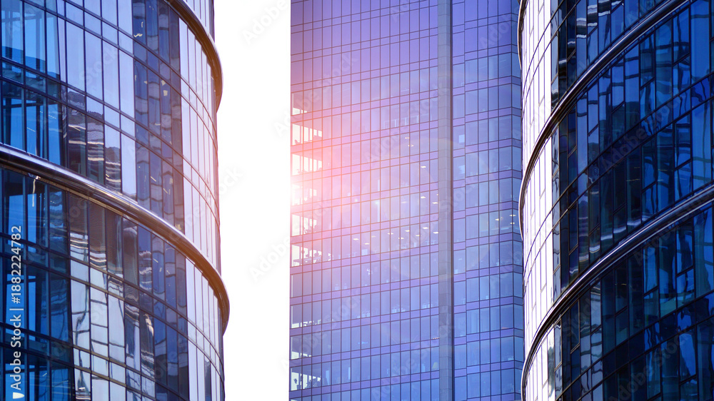 Fototapeta premium Modern office building exterior made from glass and steel. Windows of office building. Abstract architectural concept with sunlight. 