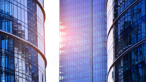 Modern office building exterior made from glass and steel. Windows of office building. Abstract architectural concept with sunlight. 