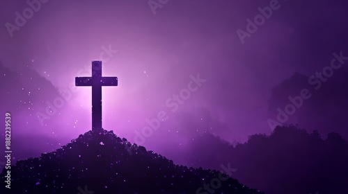 A serene Christian cross on a hill with a beautiful purple background