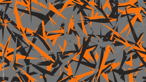Abstract geometric pattern with sharp orange and black shapes on a gray background from a direct viewpoint