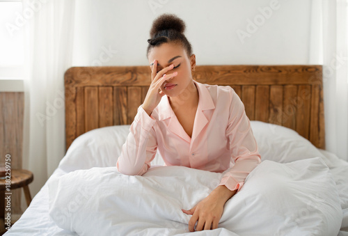 Fényképezés Upset african american lady wake up after bad sleep, tired or sleepless