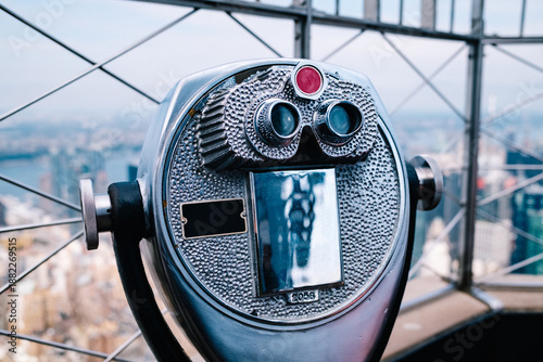 Telescope observing new york city skyline overview