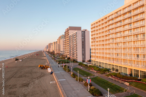 Aerial View of the Boardwalk and Hotels in Virginia Beach at Sunrise with an Empty Beach and Calm Ocean