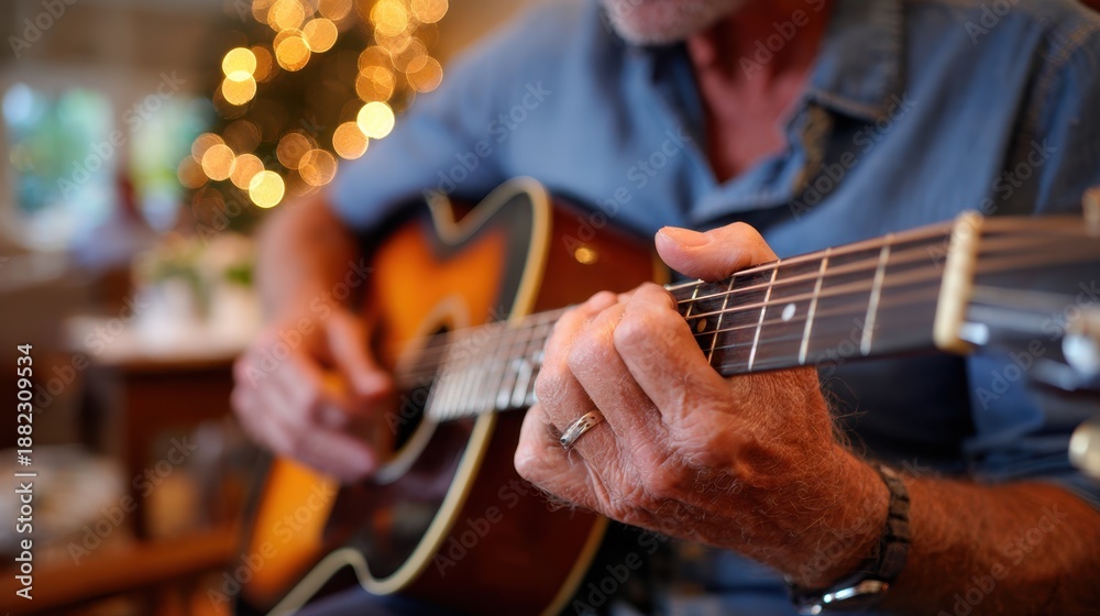 Fototapeta premium Close-up of hands playing acoustic guitar in cozy setting