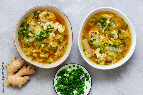 Tableau sur toile Napa cabbage egg drop soup in a ceramic bowl on a table