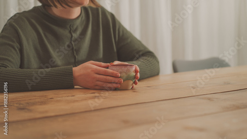 Schilderij op canvas Quiet Morning Cacao Ritual Woman Enjoying Warm Cacao Drink