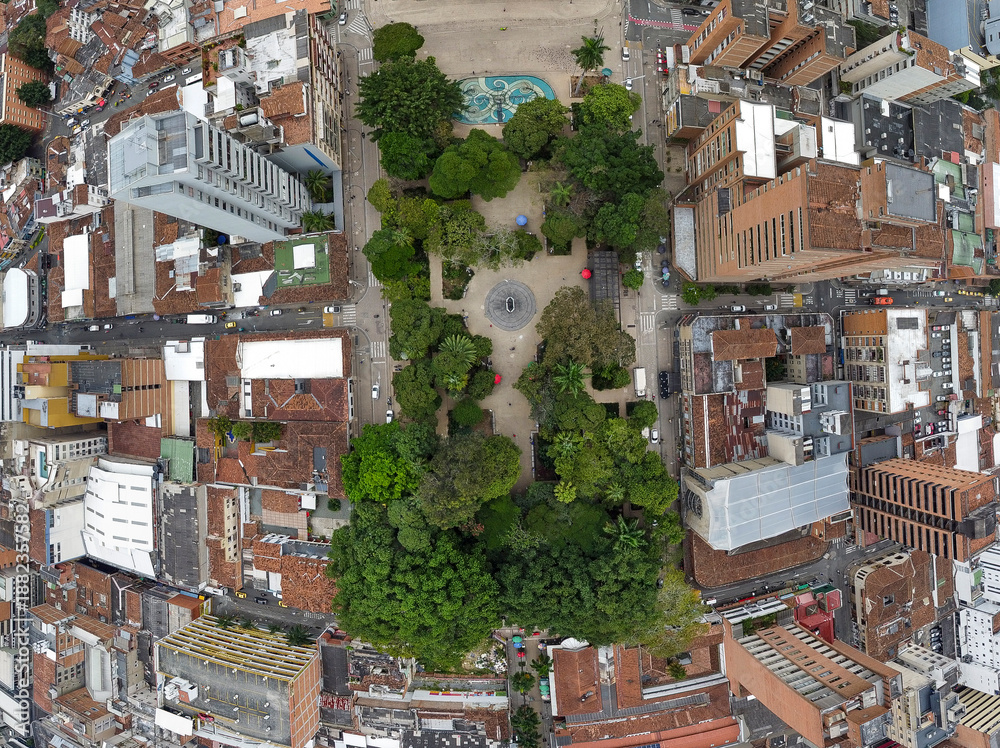 Fototapeta premium Medellin, Antioquia, Colombia - January 8, 2026. Aerial view of Bolivar Park, an urban oasis surrounded by traditional and modern architecture, with abundant vegetation.