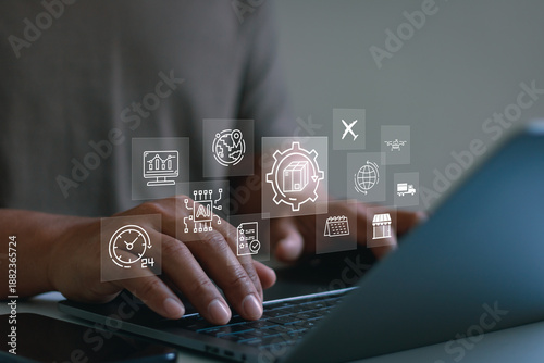 Business professional using laptop with logistics icons, AI technology, global supply chain, automation, data analytics, smart delivery, digital transformation and modern business management concept.