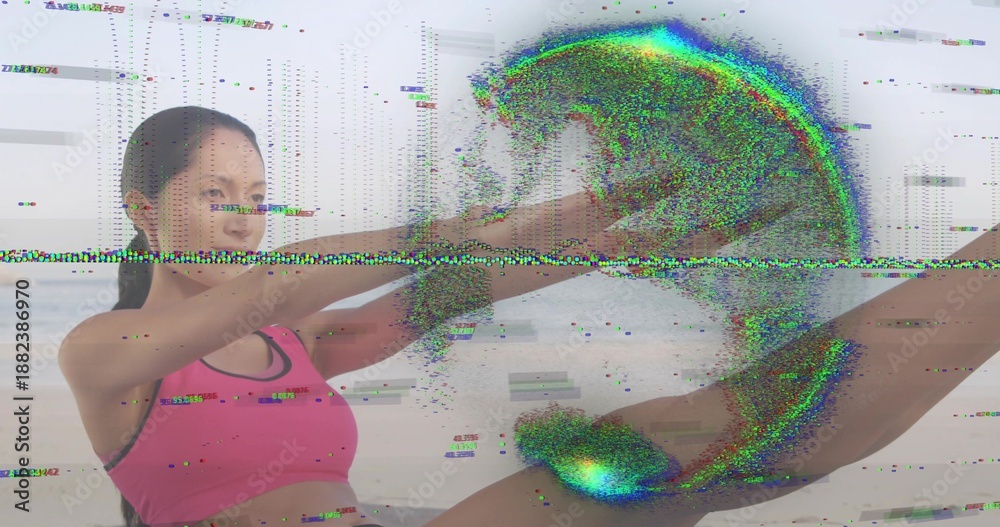 Obraz premium Doing V-sit, Chinese woman holding shins on sand, pink bra dark shorts, showing scan-line glitch