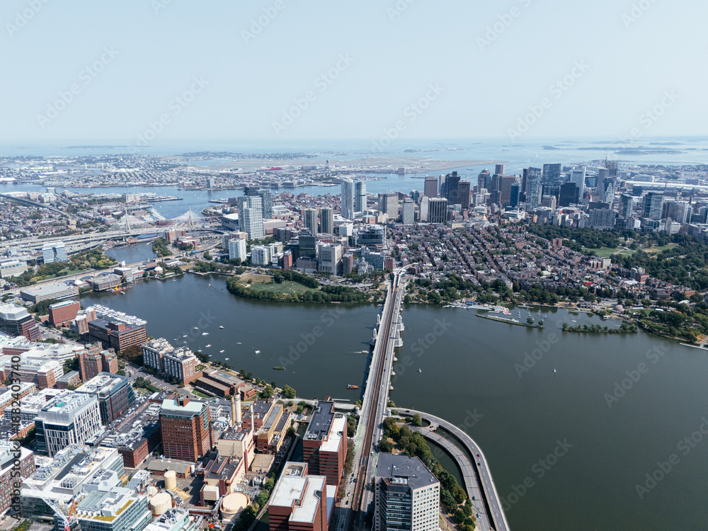 Obraz premium Aerial view of Boston skyline with Zakim Bridge, highways, Charles River and downtown cityscape on sunny day. g.