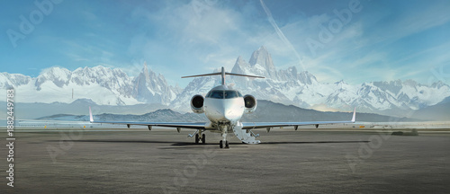 Bild auf Leinwand private jet airplane on the ground waiting to be boarded snowy mountains in the
