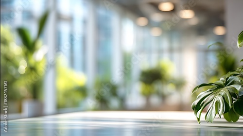 Modern Office Lobby Background with Monstera Leaf on Table and Blurred Interior