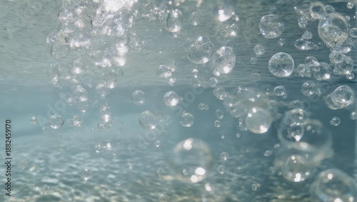Many clear bubbles rising in water