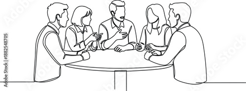 Group of people sitting around table discussing .
