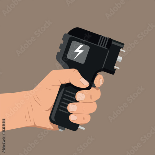 Hand holding a black electric plug adapter with a lightning symbol on a brown background, close-up.