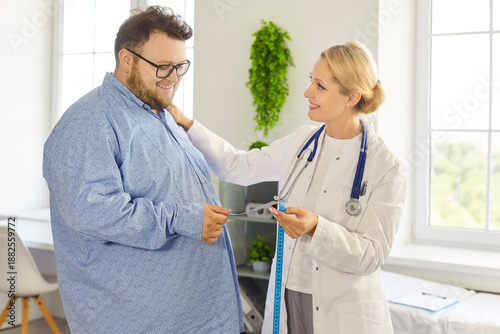 Fotografie Female doctor and fat overweight patient in health consultation