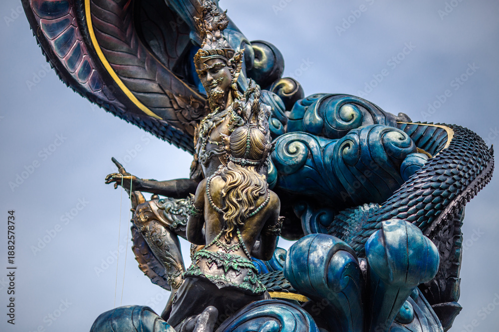 Fototapeta premium The backdrop of sculptures and artworks at tourist attractions, such as snakes, nagas, Buddha statues, and models, reflects the antiquity and stories of the place, making it captivating.