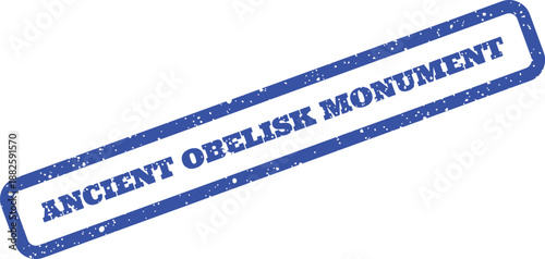 A classic blue distressed rubber stamp with ANCIENT OBELISK MONUMENT text, signifying an antique historical site