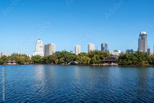 Urban Skyline with Lake and Traditional Pavilions