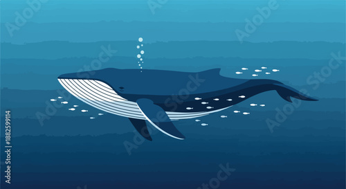 Majestic blue whale swimming in deep blue ocean water with a school of small fish swimming alongside it underwater